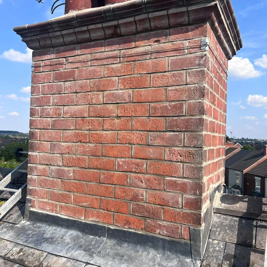 Chimney stack rebuilt with new lead flashing