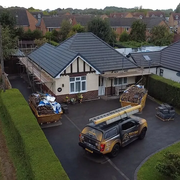 Bungalow re-roofed in grey tiles, seen from the drone