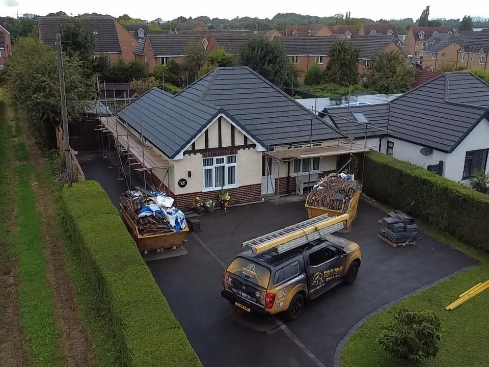 Bungalow re-roofed in grey tiles, seen from the drone