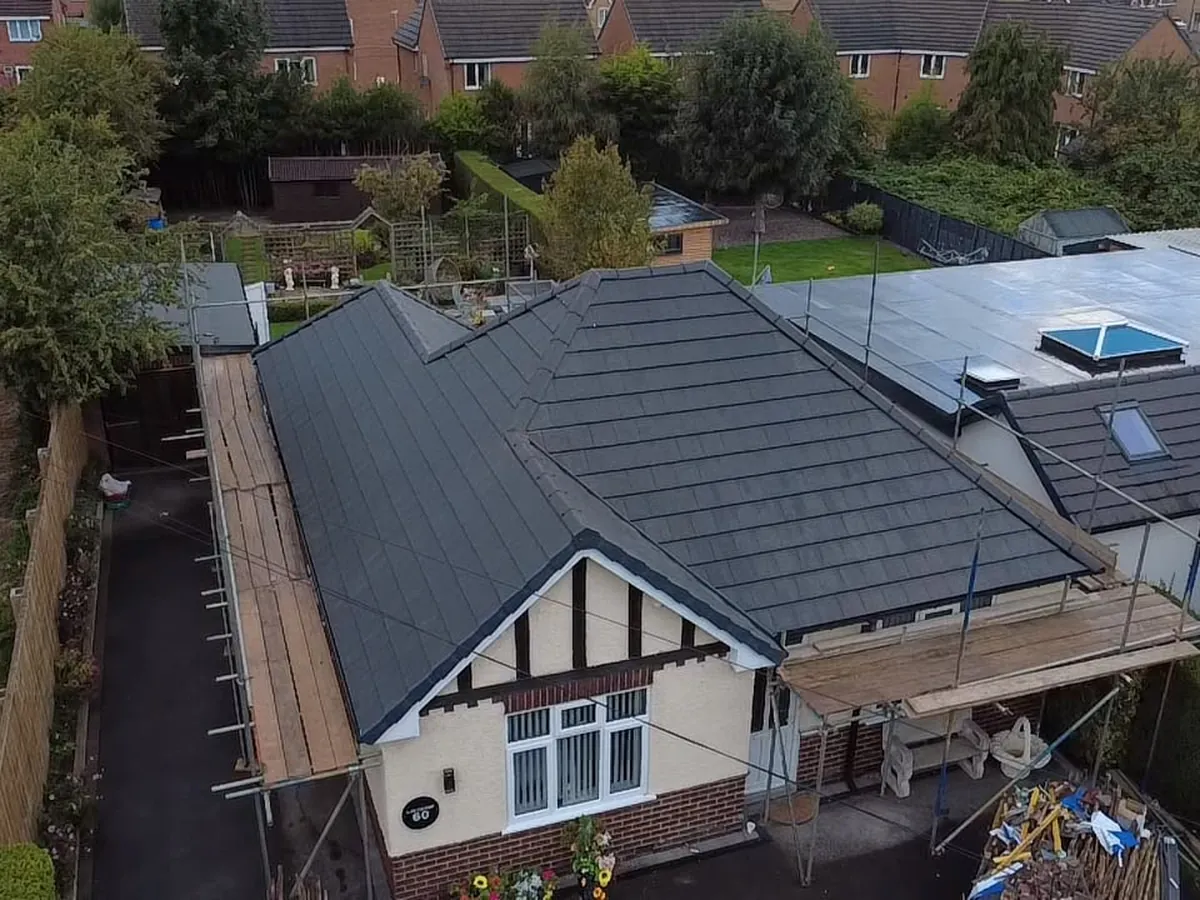 New grey tiled roof on a bungalow, from the air