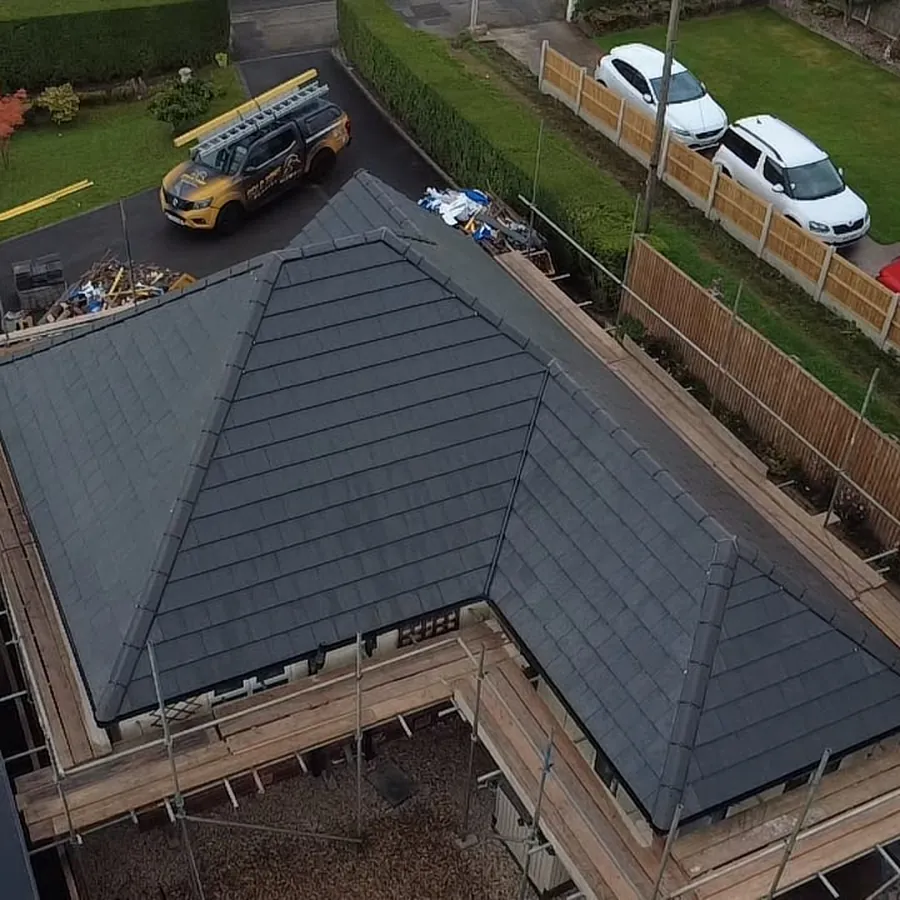 L-shaped bungalow re-roofed in grey tiles