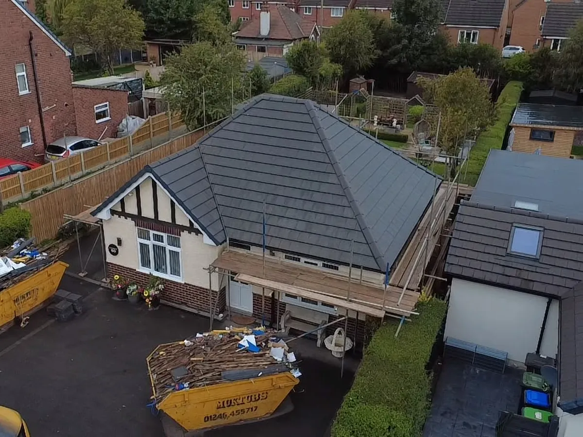 Bungalow re-roof finished, skips ready to go