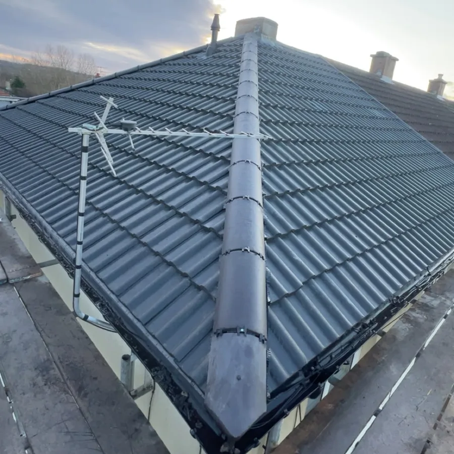 Grey interlocking tiles with a dry-fixed hip