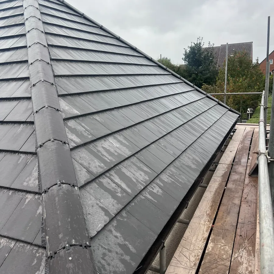 New ridge and grey tiles from the scaffold