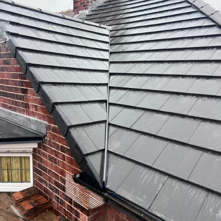 New grey tiles and valley on a re-roof
