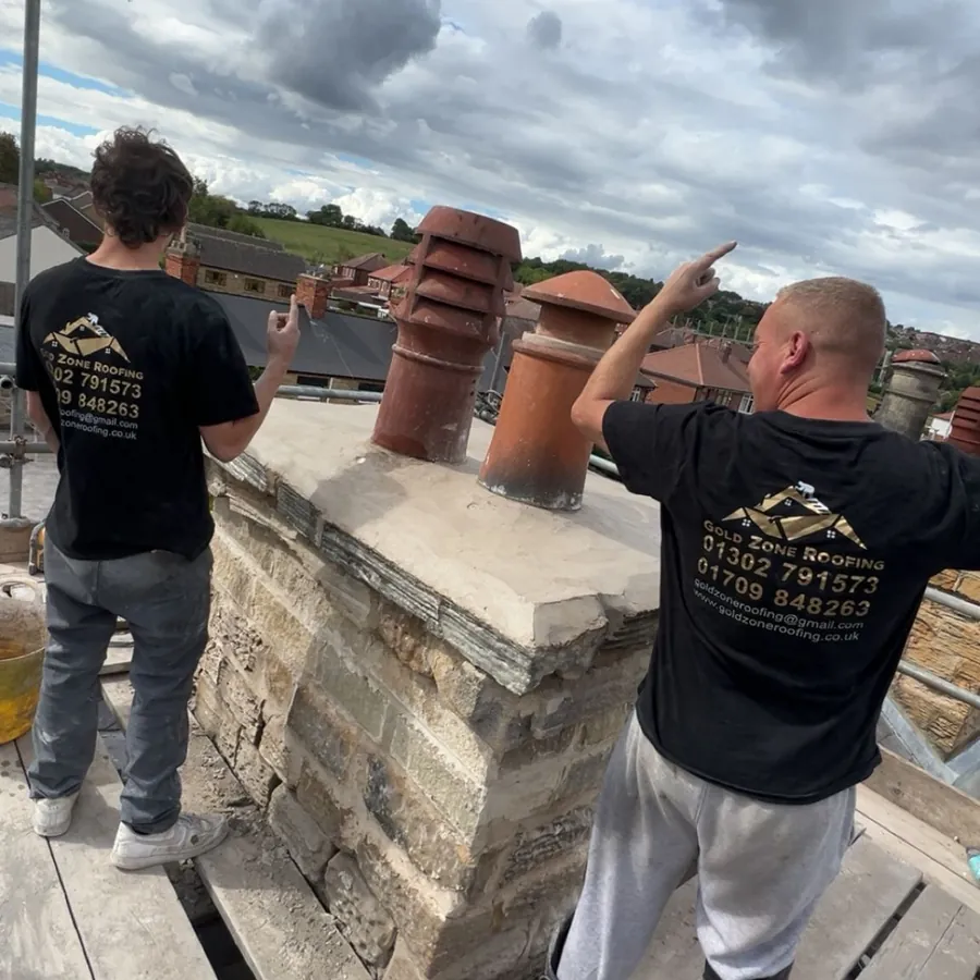 The team checking a chimney stack
